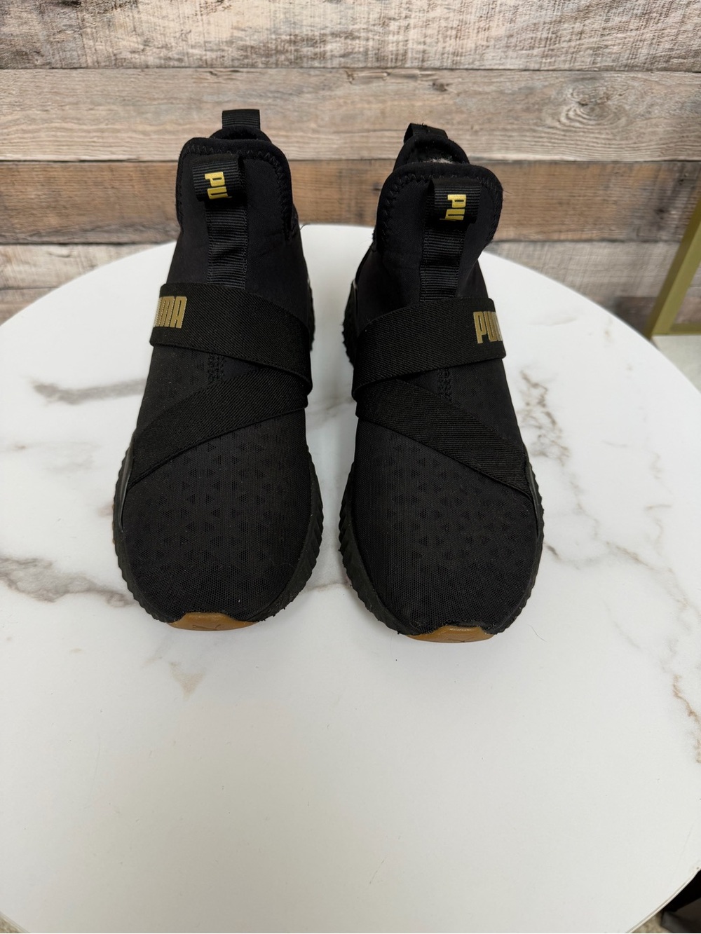 Puma Black Slip-On Sneakers with Gold Accents